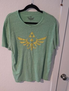 Men's Green Graphic Tee with Yellow Emblem - The Legend of Zelda